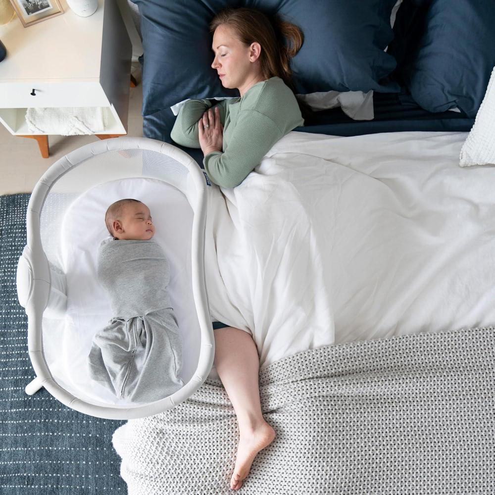 imageHALO BassiNest Swivel Sleeper 40 Signature OverBed Baby Bassinet with 360 Rotation Breathable Mesh Lowering Wall for Easy Access OatBassiNest Swivel Sleeper 30